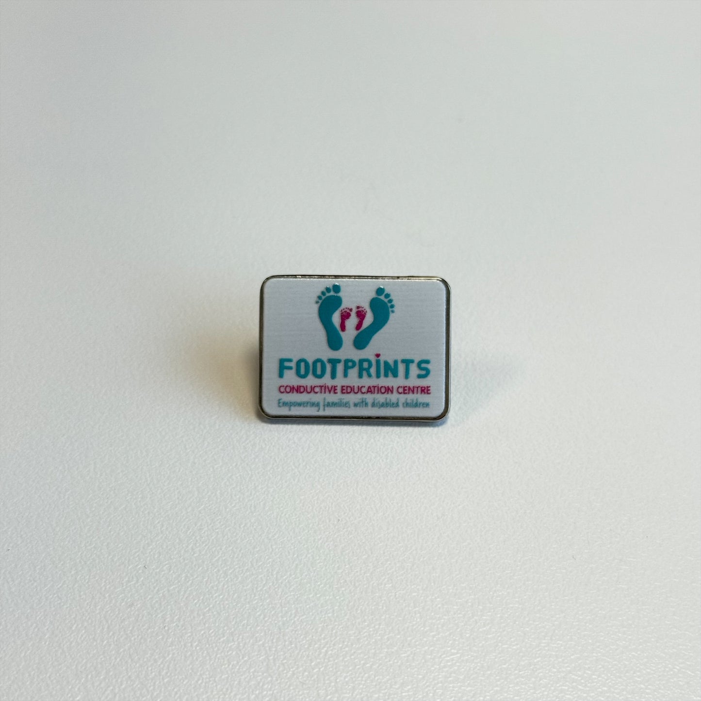 Footprints Pin Badge