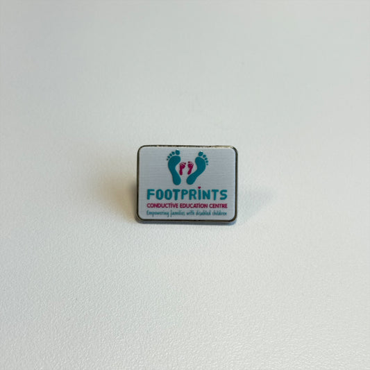 Footprints Pin Badge